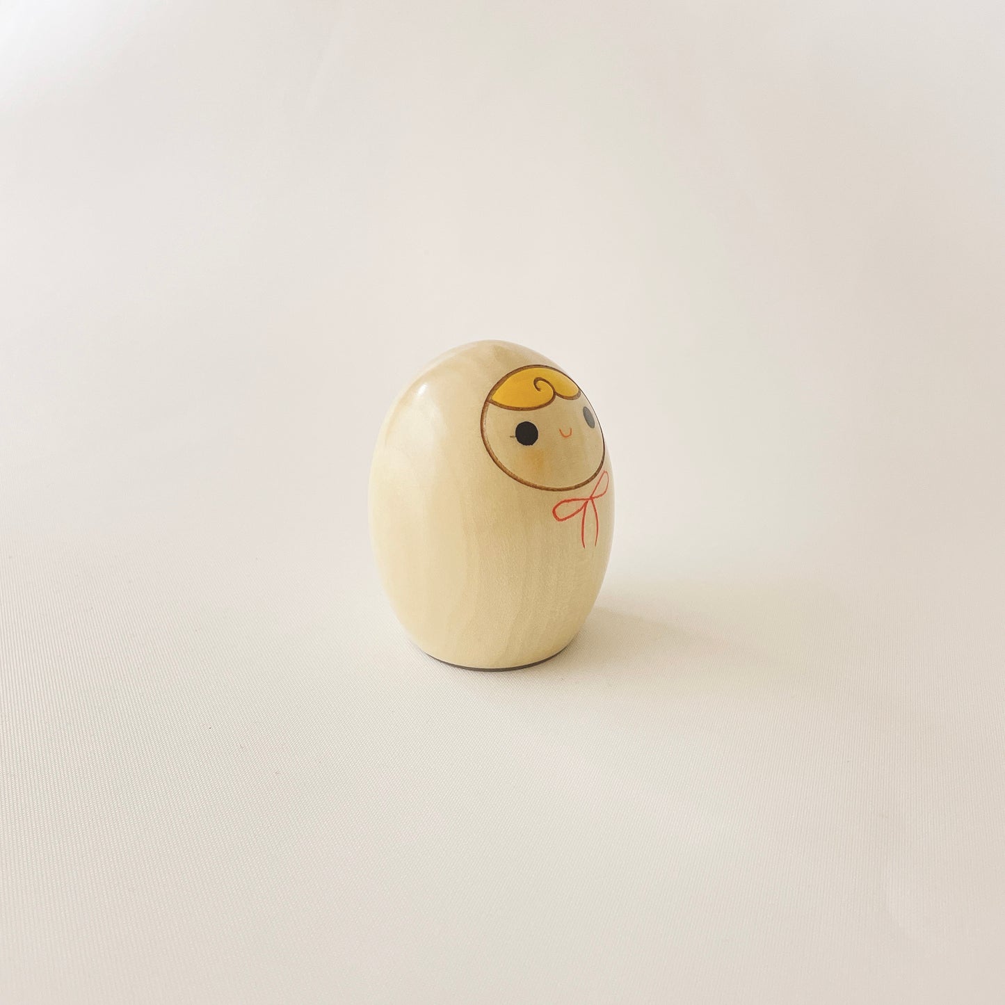 へその緒入こけし 赤リボン