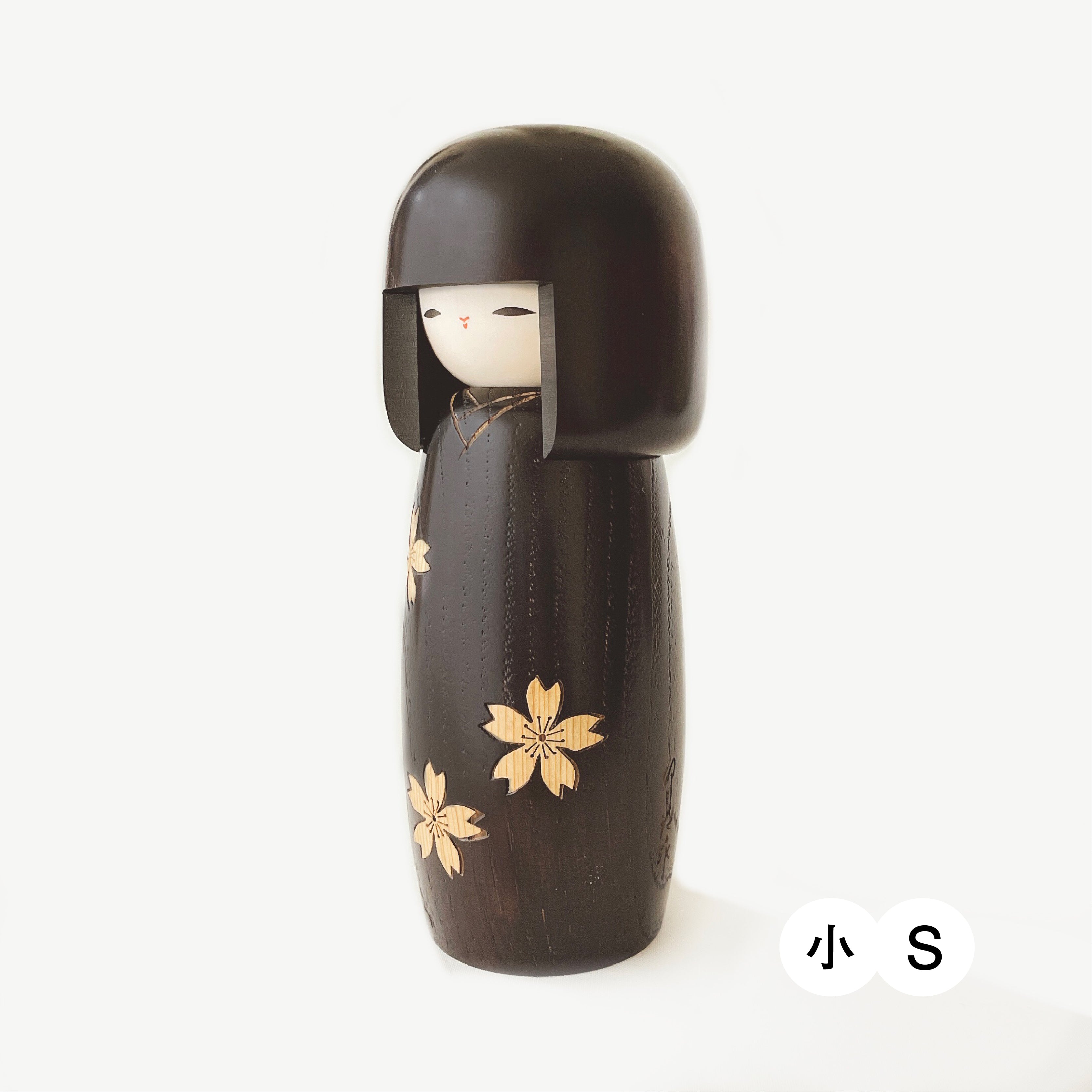 Zōkan kokeshi Sakura (Cherry blossoms made by inlay technique)